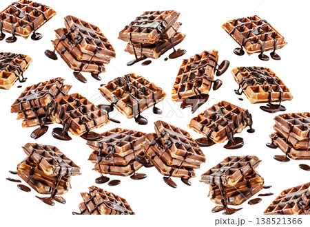 Crispy waffles generously drizzled with rich chocolate syrup, on white background. Concept of dessert, indulgence, sweetness Crispy waffles generously drizzled with rich chocolate syrup, on white background. Concept of dessert, indulgence, sweetness 138521366