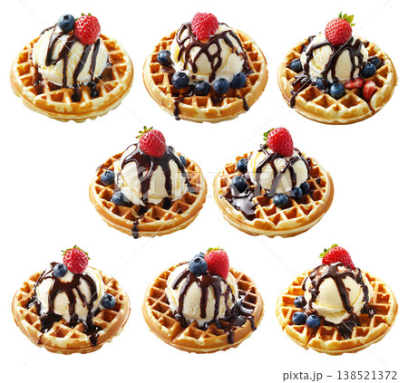 Waffle topped with vanilla ice cream, chocolate syrup, raspberry, and blueberries isolated on white background Waffle topped with vanilla ice cream, chocolate syrup, raspberry, and blueberries isolated on white background 138521372