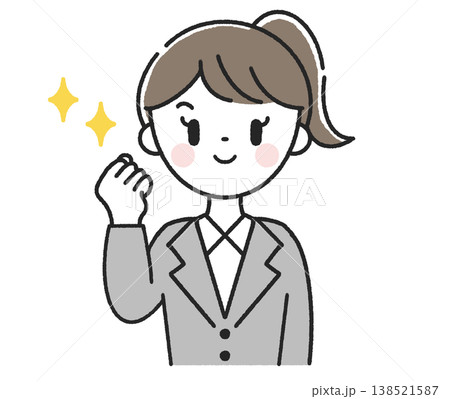 ガッツポーズをする女性社員 138521587