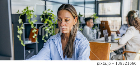 Female employee assembling materials for strategic work meeting Female employee assembling materials for strategic work meeting 138521660