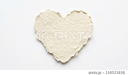 Handmade paper heart on a white background showing creativity and craft skills for art projects and gifts Handmade paper heart on a white background showing creativity and craft skills for art projects and gifts 138523838
