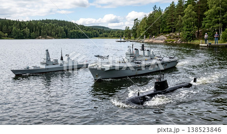 Naval vessels operate in a lake surrounded by trees with blue skies and clouds during daylight Naval vessels operate in a lake surrounded by trees with blue skies and clouds during daylight 138523846