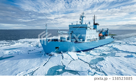 Research vessel navigates through ice in polar region under cloudy sky during daytime Research vessel navigates through ice in polar region under cloudy sky during daytime 138523885