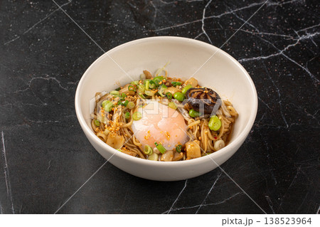Japanese mazesoba noodles with egg and mushrooms 138523964