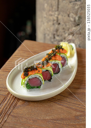 Tuna sushi rolls with tobiko and seaweed Tuna sushi rolls with tobiko and seaweed 138525035
