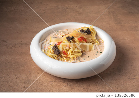 Pasta with creamy sauce truffle and parmesan 138526390