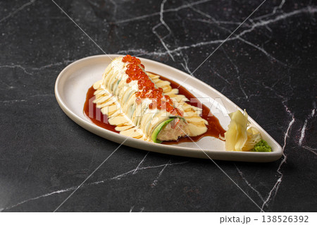 Sushi roll with creamy sauce and salmon roe 138526392