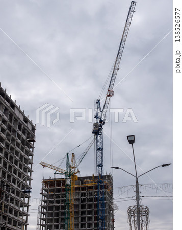 Construction of a building at Sakharov Square on the site of former Ferris wheel covered in snow cold early spring cityscape urban environment. Construction of a building at Sakharov Square on the site of former Ferris wheel covered in snow cold early spring cityscape urban environment. 138526577