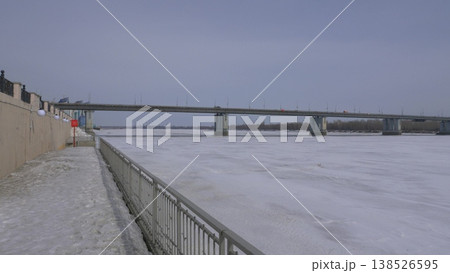 March 22 2026 Barnaul Russia new bridge over Ob River connecting Central District and right bank covered in snow cold early spring cityscape urban infrastructure and winter atmosphere. 138526595