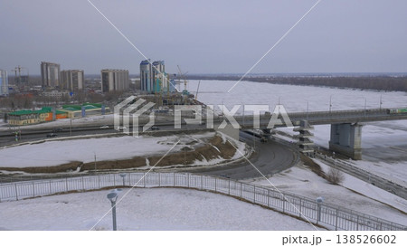 March 22 2026 Barnaul Russia new bridge over Ob River connecting Central District and right bank covered in snow cold early spring cityscape urban infrastructure and winter atmosphere. 138526602