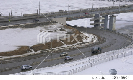 March 22 2026 Barnaul Russia new bridge over Ob River connecting Central District and right bank covered in snow cold early spring cityscape urban infrastructure and winter atmosphere. March 22 2026 Barnaul Russia new bridge over Ob River connecting Central District and right bank covered in snow cold early spring cityscape urban infrastructure and winter atmosphere. 138526605