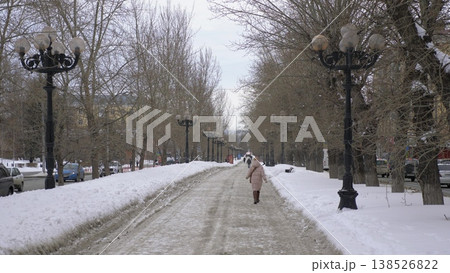 March 22 2026 Barnaul Russia alley on Leninsky Avenue opposite Polytechnic University covered in snow cold early spring cityscape urban environment and winter atmosphere. 138526822