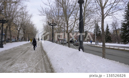 March 22 2026 Barnaul Russia alley on Leninsky Avenue opposite Polytechnic University covered in snow cold early spring cityscape urban environment and winter atmosphere. March 22 2026 Barnaul Russia alley on Leninsky Avenue opposite Polytechnic University covered in snow cold early spring cityscape urban environment and winter atmosphere. 138526826