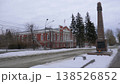 March 22 2026 Barnaul Russia Fallen Fighters for Socialism Monument and city administration building covered in snow cold early spring cityscape urban architecture and winter atmosphere. 138526852