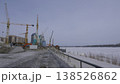 March 22 2026 Barnaul Russia construction of a new building on the site of the former river station covered in snow cold early spring urban cityscape and winter atmosphere. 138526862