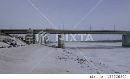 March 22 2026 Barnaul Russia new bridge over Ob River connecting Central District and right bank covered in snow cold early spring cityscape urban infrastructure and winter atmosphere. 138526865