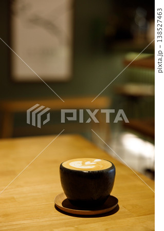 Cup of hot milk piccolo latte coffee on table. Cup of hot milk piccolo latte coffee on table. 138527463