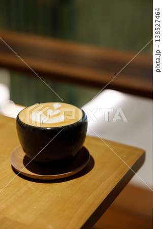 Cup of hot milk piccolo latte coffee on table. Cup of hot milk piccolo latte coffee on table. 138527464