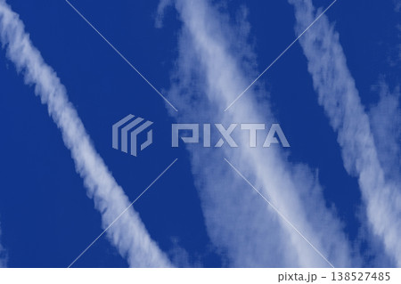Traces airplane blue sky clouds background abstract lines stripes pattern Traces airplane blue sky clouds background abstract lines stripes pattern 138527485