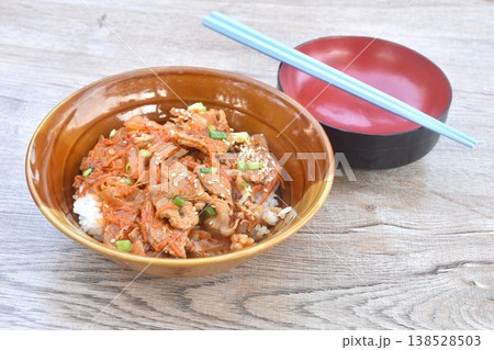 fried slice fermenting pork meat with spicy Japanese sauce topping white sesame and pickled ginger on plain rice in bowl fried slice fermenting pork meat with spicy Japanese sauce topping white sesame and pickled ginger on plain rice in bowl 138528503