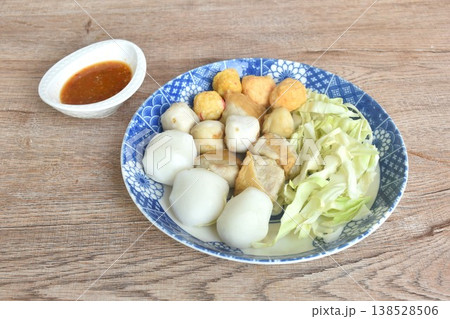 steamed fish and shrimp meatball with chop cabbage on plate dipping Thai spicy chili seafood sauce steamed fish and shrimp meatball with chop cabbage on plate dipping Thai spicy chili seafood sauce 138528506