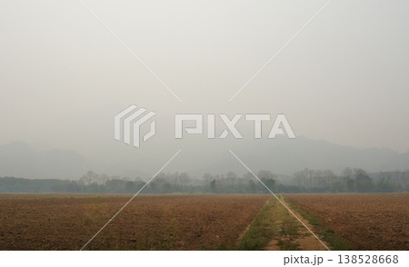 Hazy Border Mountain Range Under Smoke Blanket 138528668