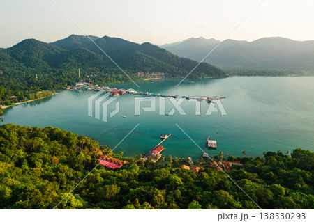 Aerial view of Bang Bao fishing village and pier, Ko Chang island, Thailand. Traditional coastal community with mountai Aerial view of Bang Bao fishing village and pier, Ko Chang island, Thailand. Traditional coastal community with mountai 138530293