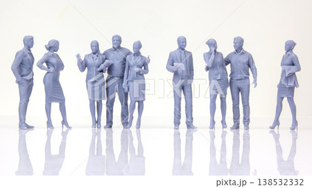 Miniature people standing together in a line holding papers in a bright space during the day Miniature people standing together in a line holding papers in a bright space during the day 138532332