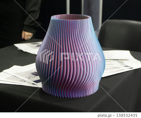 3D printed art object. Art object printed on 3D printer from melted colored plastic. Model in shape vase created on 3D printer from threads of molten plastic. Modern additive progressive technologies 138532435