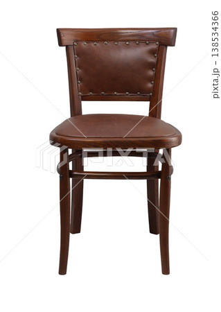 Discovering the elegance of simple design in a vintage wooden dining chair with a leather seat and studded backrest 138534366