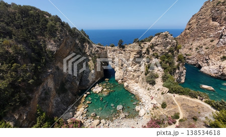 Rocky sea arch. A stunning view of the seashore. Rocky arch flowers. High quality 4k footage Rocky sea arch. A stunning view of the seashore. Rocky arch flowers. High quality 4k footage 138534618