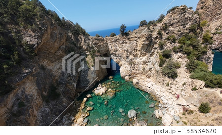 Rocky sea arch. A stunning view of the seashore. Rocky arch flowers. High quality 4k footage 138534620