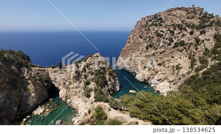 Rocky sea arch. A stunning view of the seashore. Rocky arch flowers. High quality 4k footage 138534625