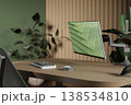 Eco-friendly workspace with wooden desk, green plants and modern computer monitor. 3D render 138534810