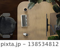 Eco-friendly workspace with wooden desk, green plants and modern computer monitor. 3D render 138534812