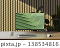 Eco-friendly workspace with wooden desk, green plants and modern computer monitor. 3D render 138534816