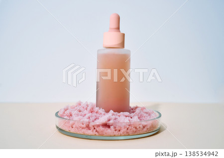 Cosmetic innovations combining serum dropper bottle and pink salt scrub Cosmetic innovations combining serum dropper bottle and pink salt scrub 138534942
