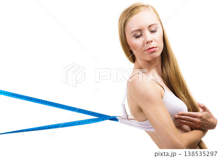 Woman wearing too big bra, loose band 138535297