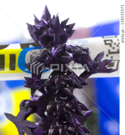 3D printed art object. Object printed on 3D printer from melted colored purple plastic. Model created on 3D printer from threads of molten plastic. Modern new additive progressive printing technology 138535371