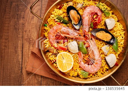 Seafood paella, in a frying pan, on a wooden table, no people, 138535645