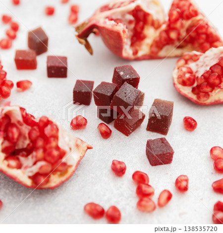 Home made candied fruit jelly with pomegranate fruits on white. Marmalade jelly candies 138535720