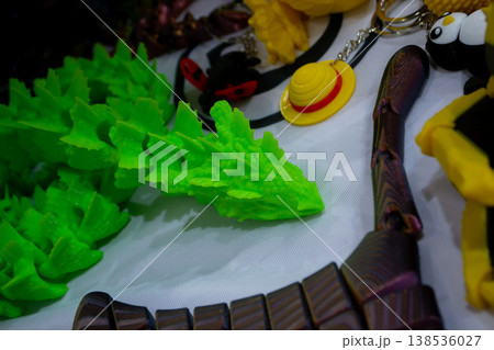 3D printed different art objects. Objects printed on 3D printer from melted colored plastic. Model green dragon created on 3D printer from threads of molten plastic. Modern new additive technologies 3D printed different art objects. Objects printed on 3D printer from melted colored plastic. Model green dragon created on 3D printer from threads of molten plastic. Modern new additive technologies 138536027