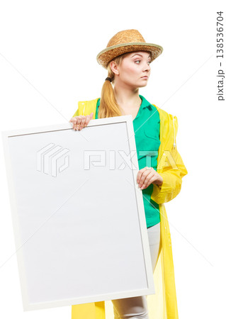 Happy cheerful woman holding blank white board 138536704
