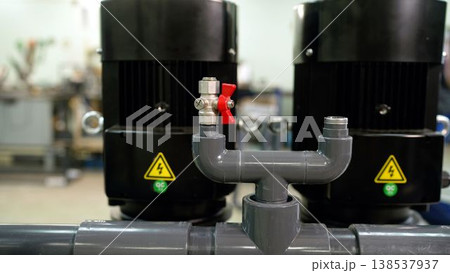 Industrial pumping station with electric motors and PVC pipes 138537937