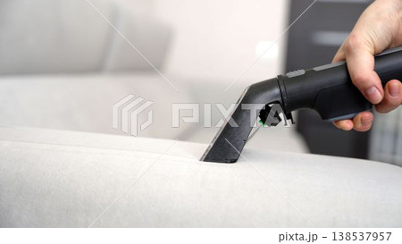 Cleaning Upholstery on a Sofa 138537957