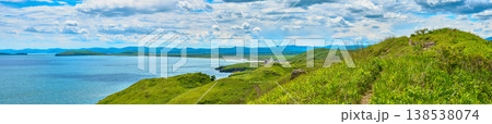 The nature of the Khasansky district of Primorsky Krai, Russia. The lip of the Teal of the Slavic Bay, the inner bay of Peter the Great in the summer. Panorama. The nature of the Khasansky district of Primorsky Krai, Russia. The lip of the Teal of the Slavic Bay, the inner bay of Peter the Great in the summer. Panorama. 138538074