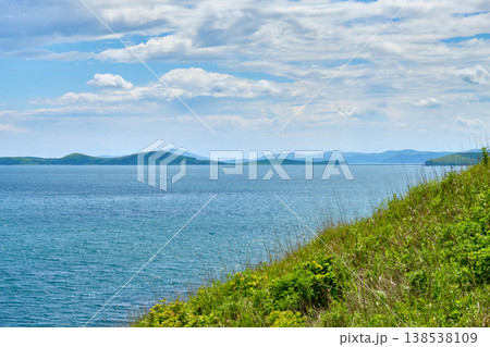 The nature of the Khasansky district of Primorsky Krai, Russia. The lip of the Teal of the Slavic Bay, the inner bay of Peter the Great in the summer. The nature of the Khasansky district of Primorsky Krai, Russia. The lip of the Teal of the Slavic Bay, the inner bay of Peter the Great in the summer. 138538109