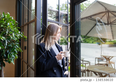 Thoughtful businesswoman restaurant director enjoying coffee and thinking planning new career goals. 138538610