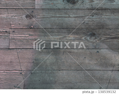 Weathered wood planks forming a rustic surface texture with visible grain patterns and knots, perfect for backgrounds, flooring, and natural design elements. Weathered wood planks forming a rustic surface texture with visible grain patterns and knots, perfect for backgrounds, flooring, and natural design elements. 138539132