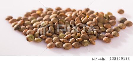 Raw lentils on white background Raw lentils on white background 138539158